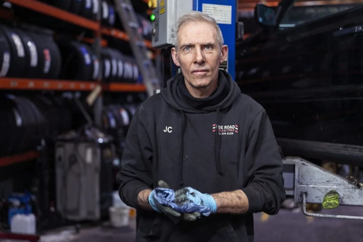 Mechanic carrying out a vehicle service inspection at Hyde Road Wheels & Tyres in Manchester